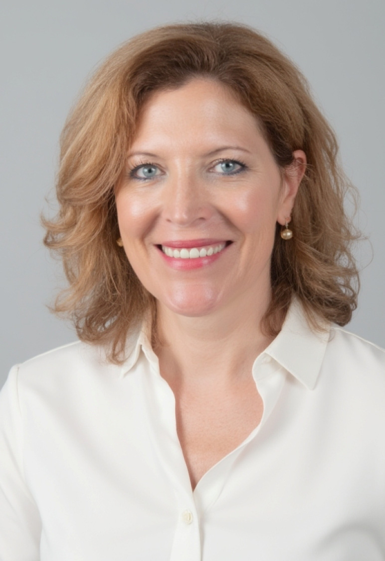 White collared blouse displayed on person, smiling at the camera.